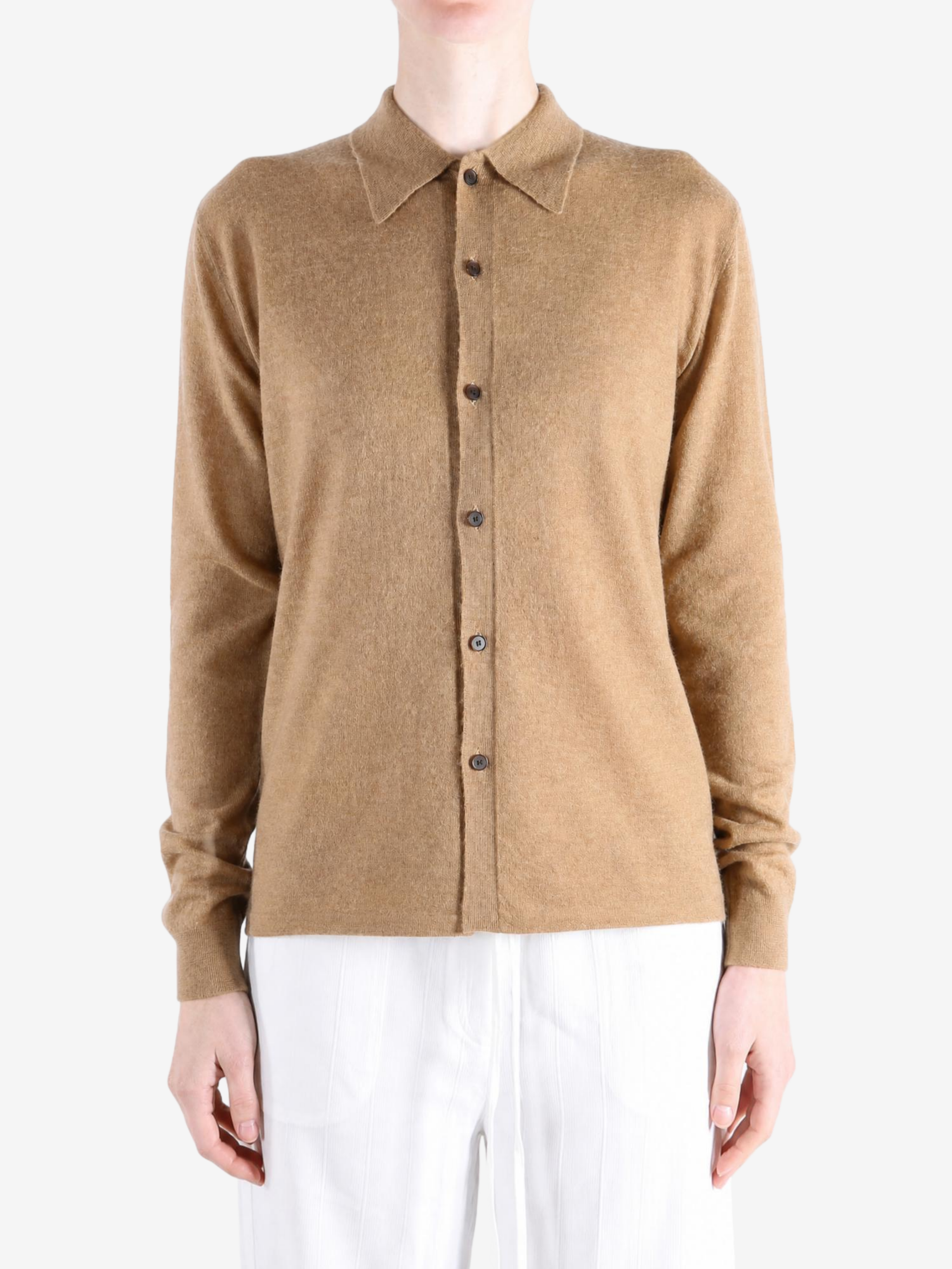 Tan knitwear worn by a person, showing the knitwear fit