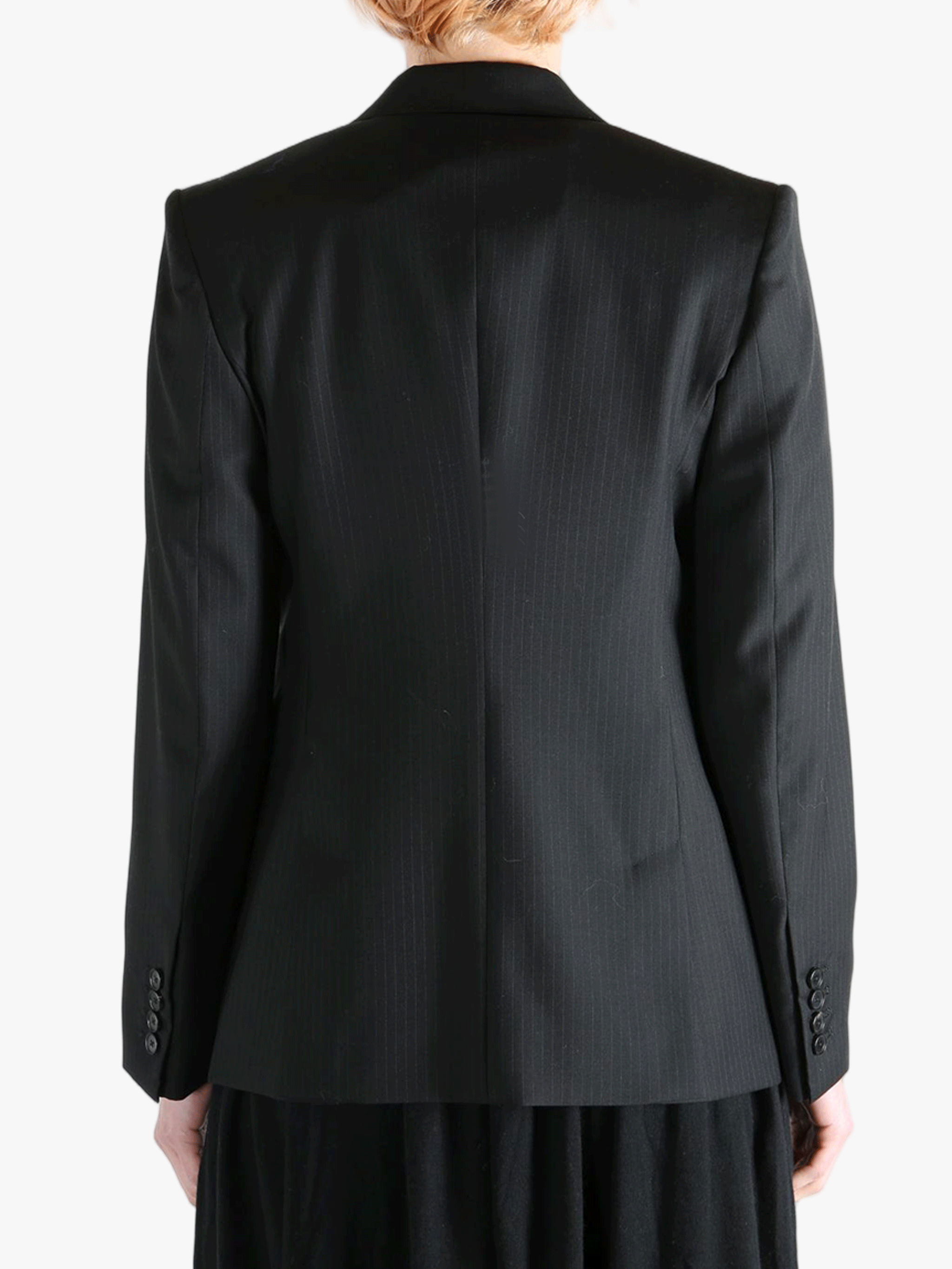 Black jacket worn by a person, showing the jacket's fit