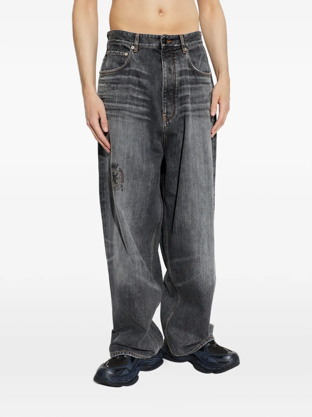 Grey pants worn by a person, showing the pants fit