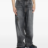 Grey pants worn by a person, showing the pants fit