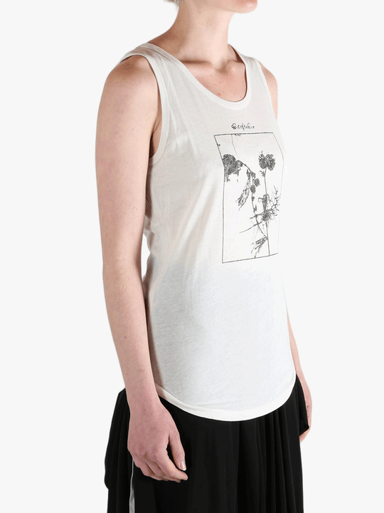 White top worn by a person, showing the top's fit