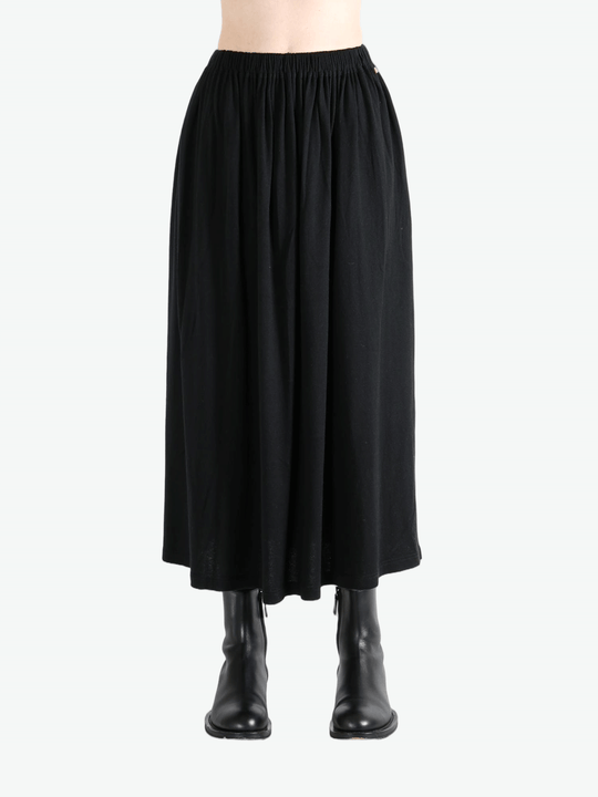 Black skirt worn by a person,showing the skirt fit