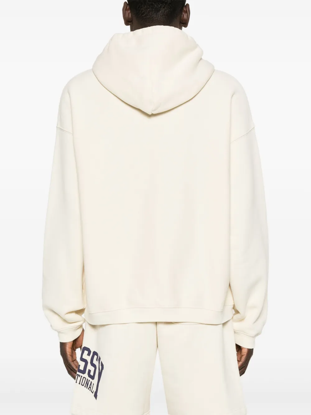 White hoodies worn by a person, showing the hoodies fit