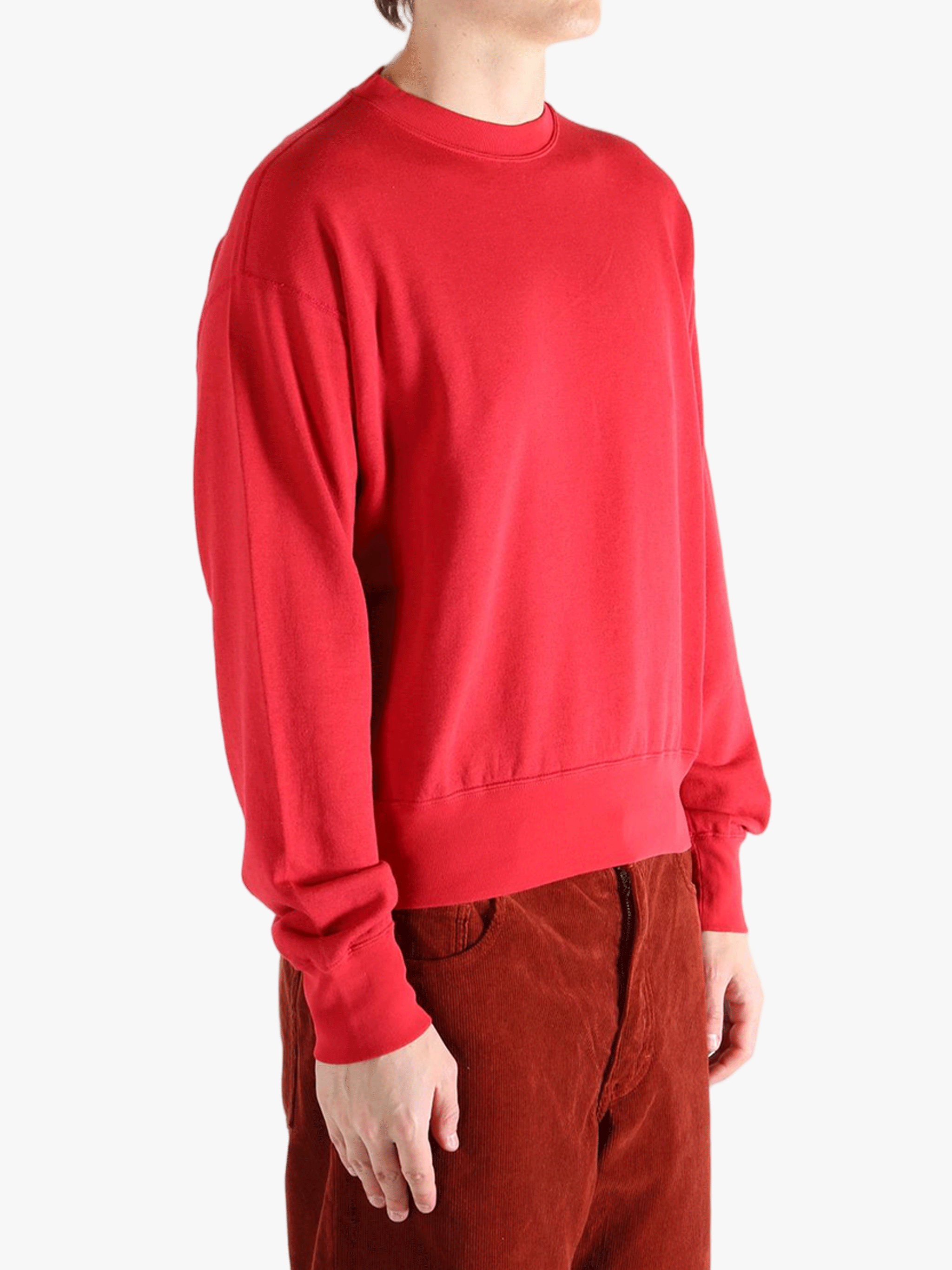 Red knitwear worn by a person, showing the knitwear's fit