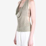 Green top worn by a person, showing the top fit