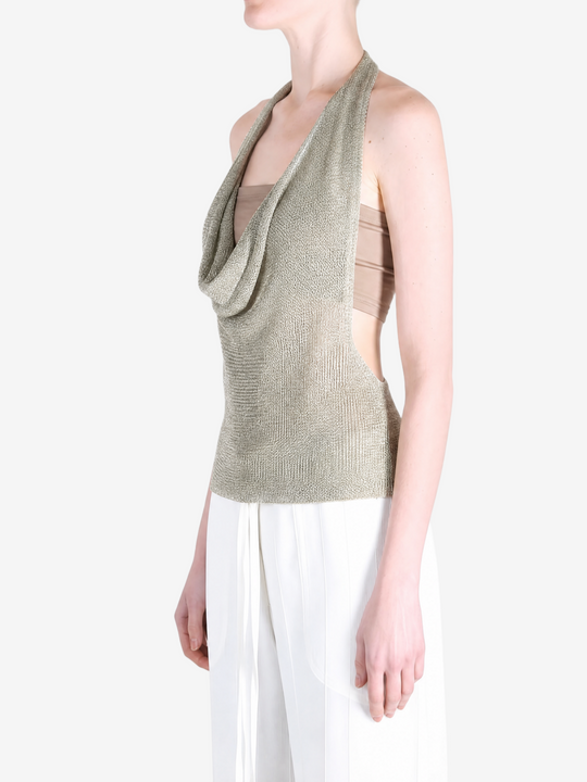 Green top worn by a person, showing the top fit