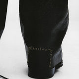 Close up of Balck pants, showing texture of the cotton fabric