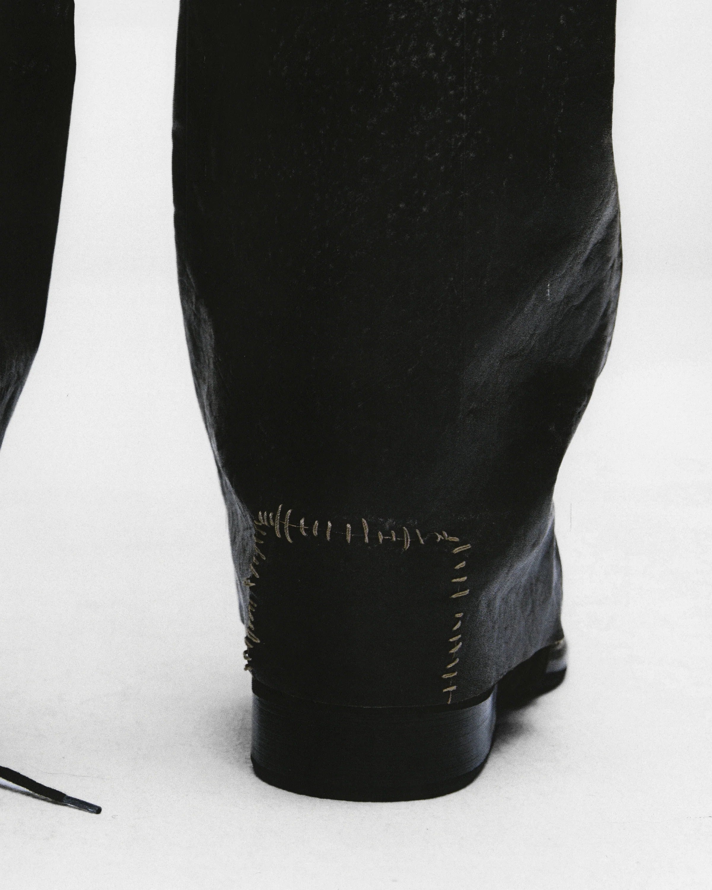 Close up of Balck pants, showing texture of the cotton fabric