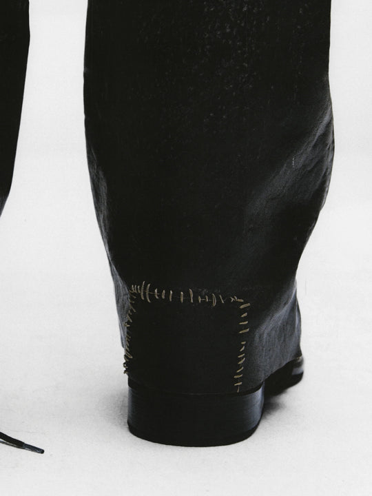 Close up of Balck pants, showing texture of the cotton fabric