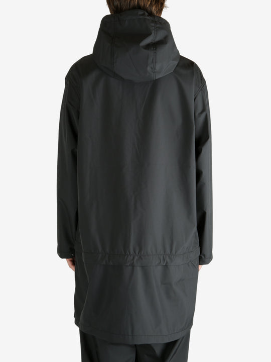 Black jackets worn by a person, showing the jacket’s fit