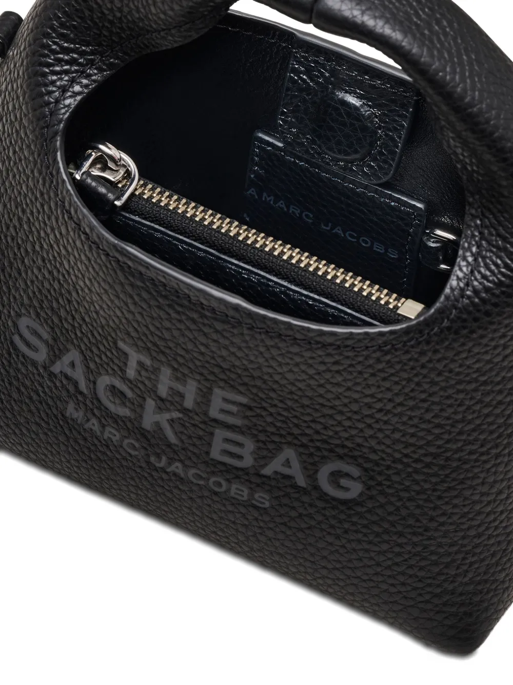 close up of black bags, showing texture of the leather fabric