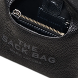 close up of black bags, showing texture of the leather fabric