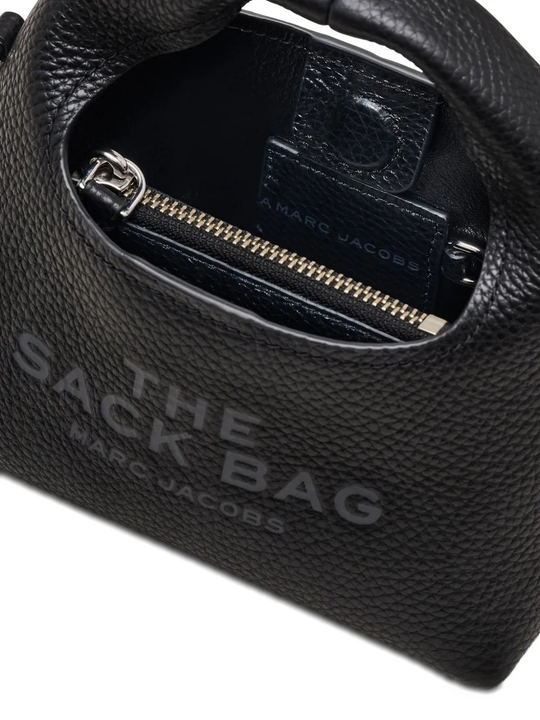 close up of black bags, showing texture of the leather fabric
