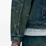 Close up of blue jacket, showing texture of the cotton fabric
