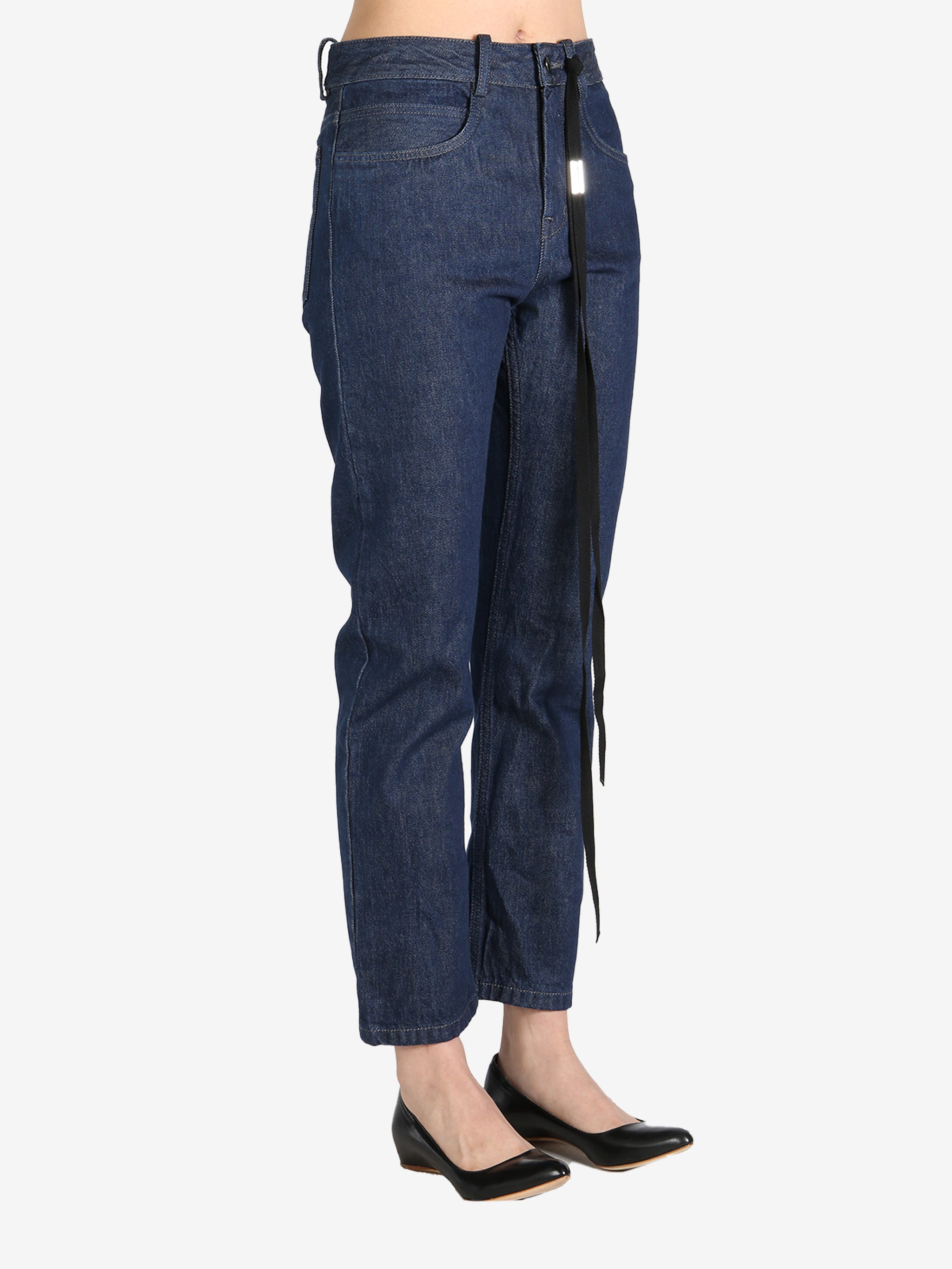 Dark blue pants worn by a person, showing the pants's fit