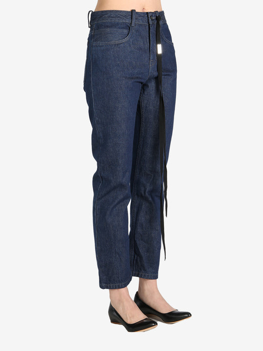 Dark blue pants worn by a person, showing the pants's fit