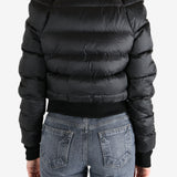 Black jacket worn by a person, showing the jacket fit