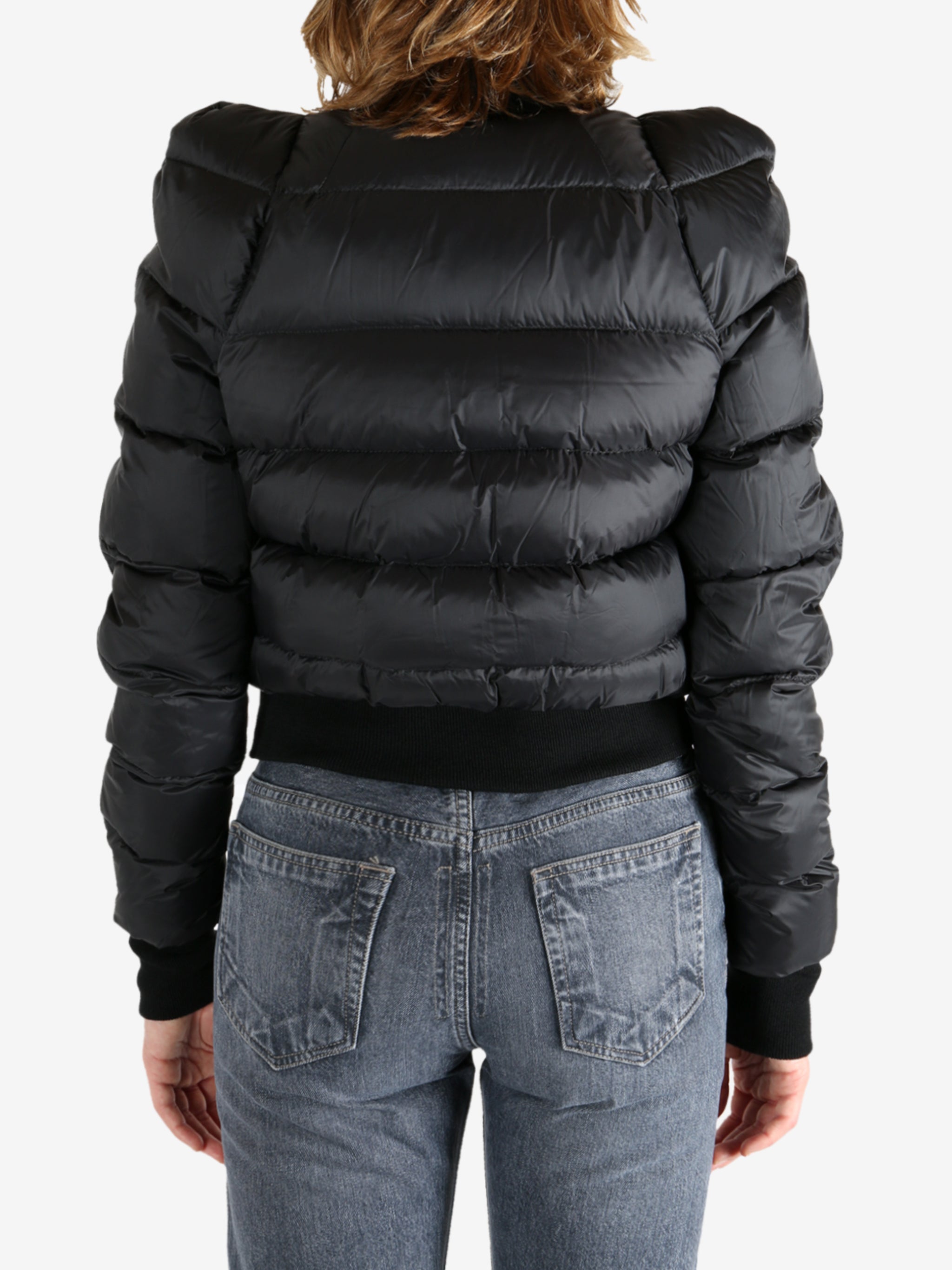 Black jacket worn by a person, showing the jacket fit