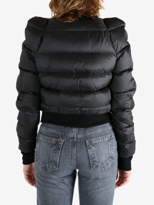 Black jacket worn by a person, showing the jacket fit