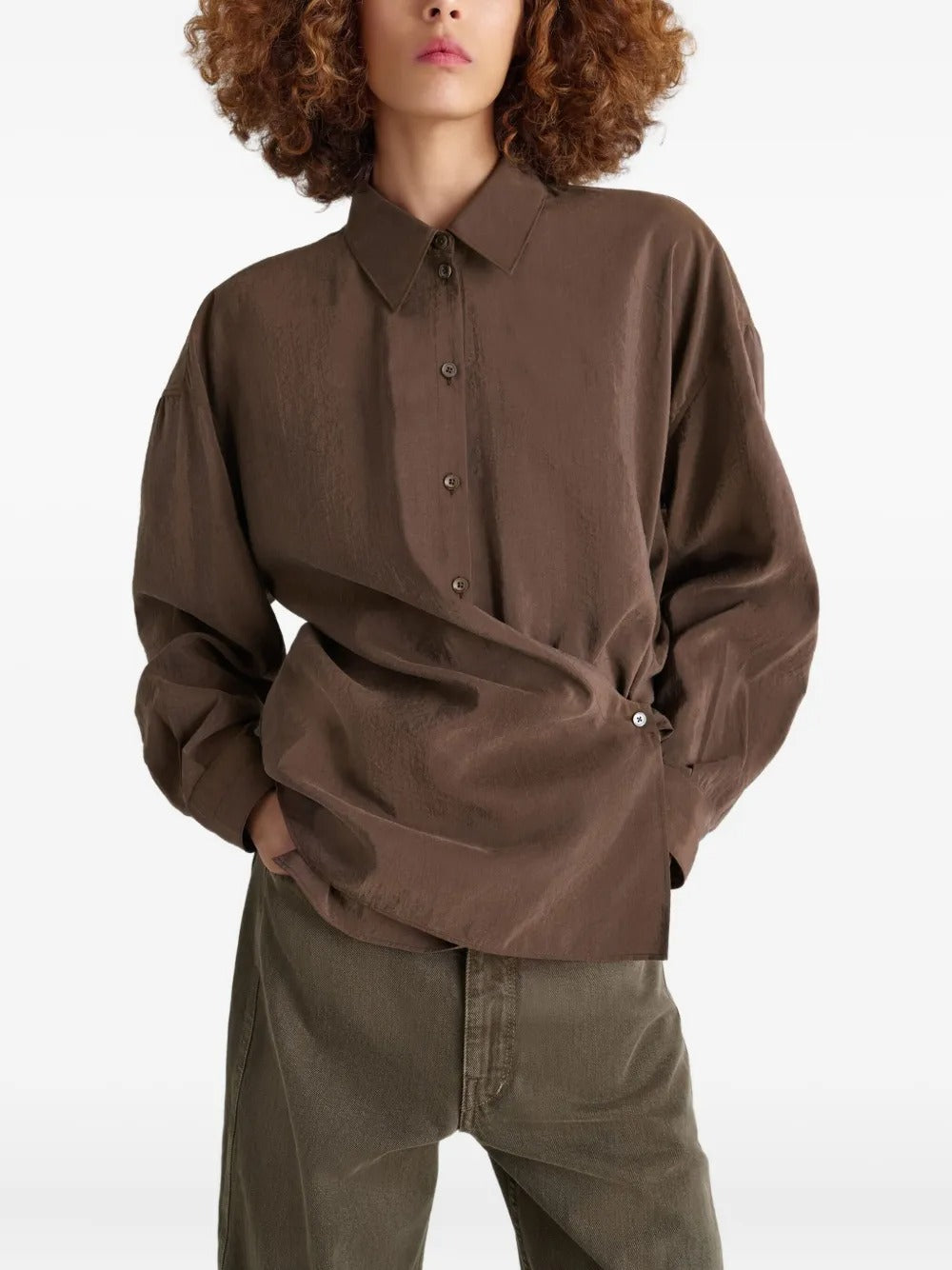 Brown shirt worn by a person, showing the shirt's fit