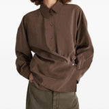 Brown shirt worn by a person, showing the shirt's fit