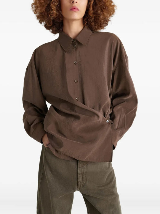 Brown shirt worn by a person, showing the shirt's fit