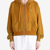 Orange hoodie worn by a person, showing the hoodie fit