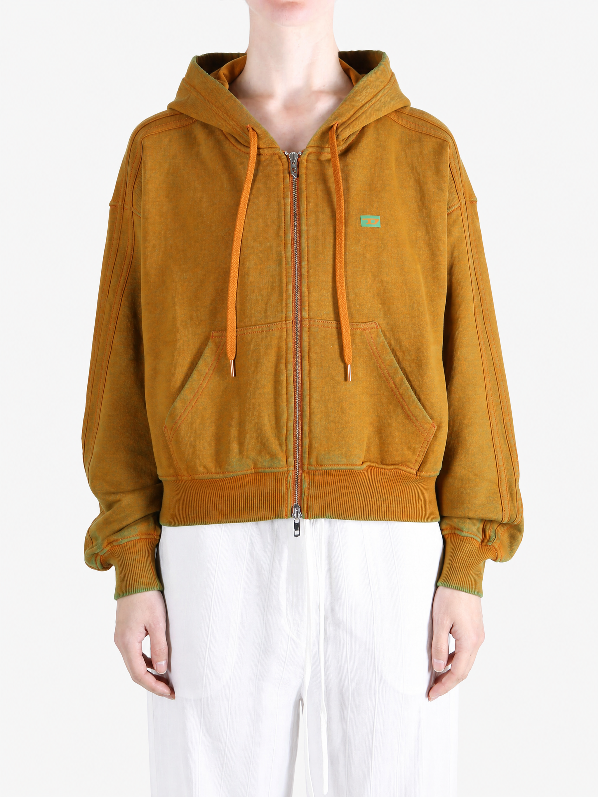 Orange hoodie worn by a person, showing the hoodie fit