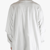 White sweats worn by a person, showing the sweats fit