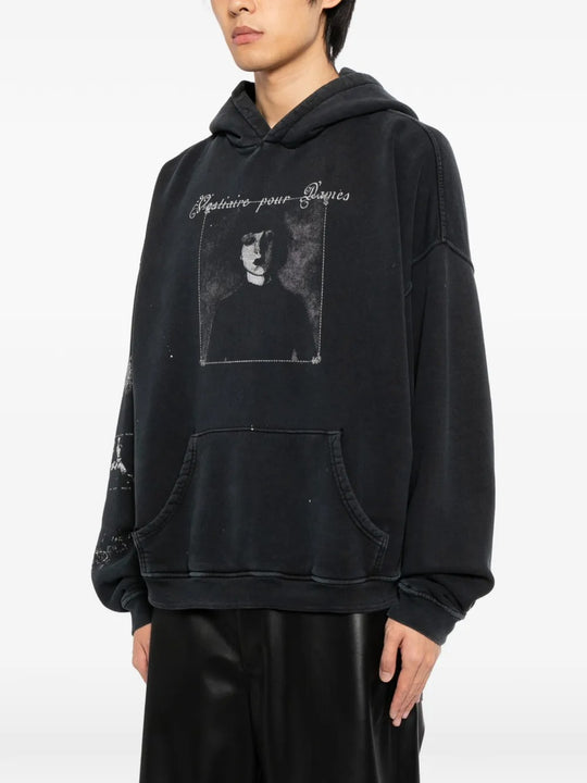 Black hoodie worn by a person, showing the hoodie's fit