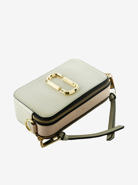 Close up of tan bag, showing texture of the leather fabric