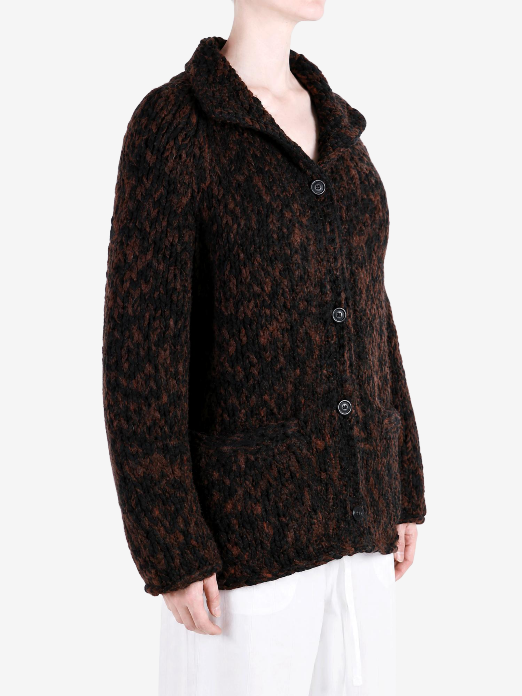 Brown knitwear worn by a person, showing the knitwear fit