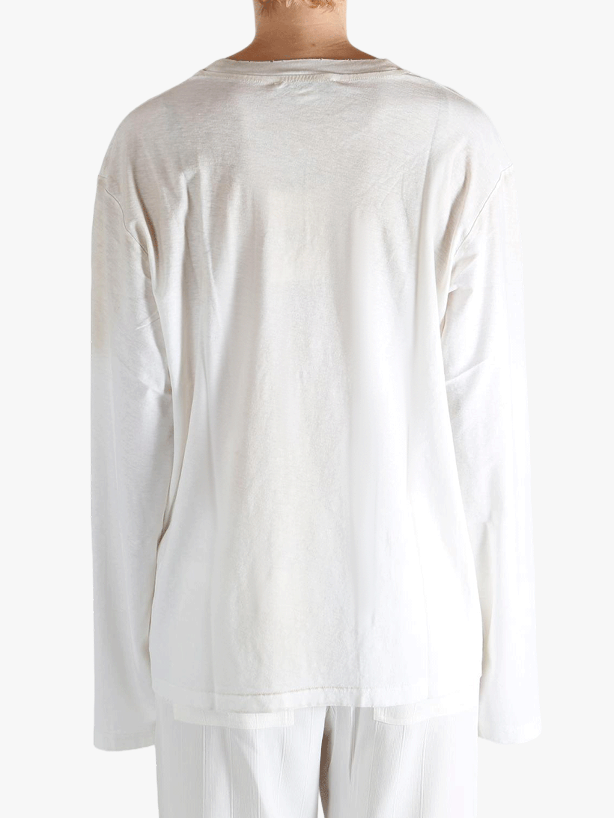 White t-shirt worn by a person, showing the t-shirt fit