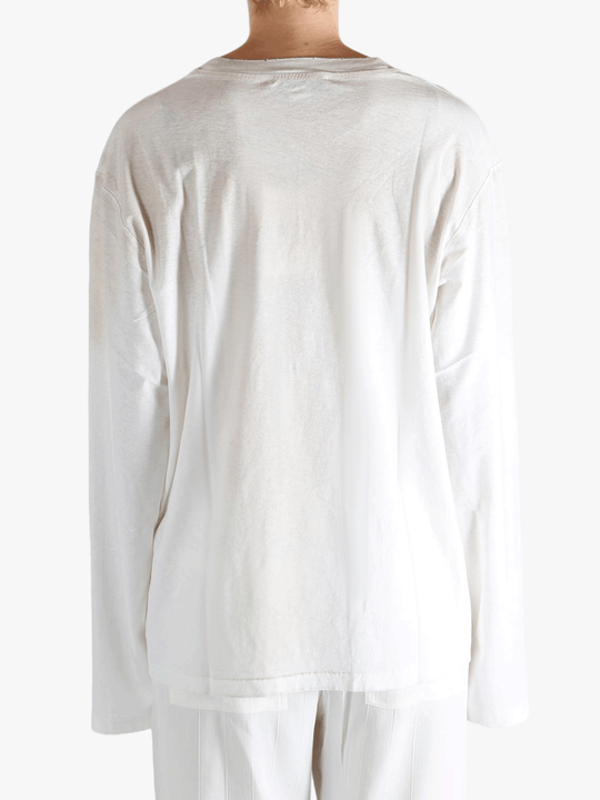 White t-shirt worn by a person, showing the t-shirt fit