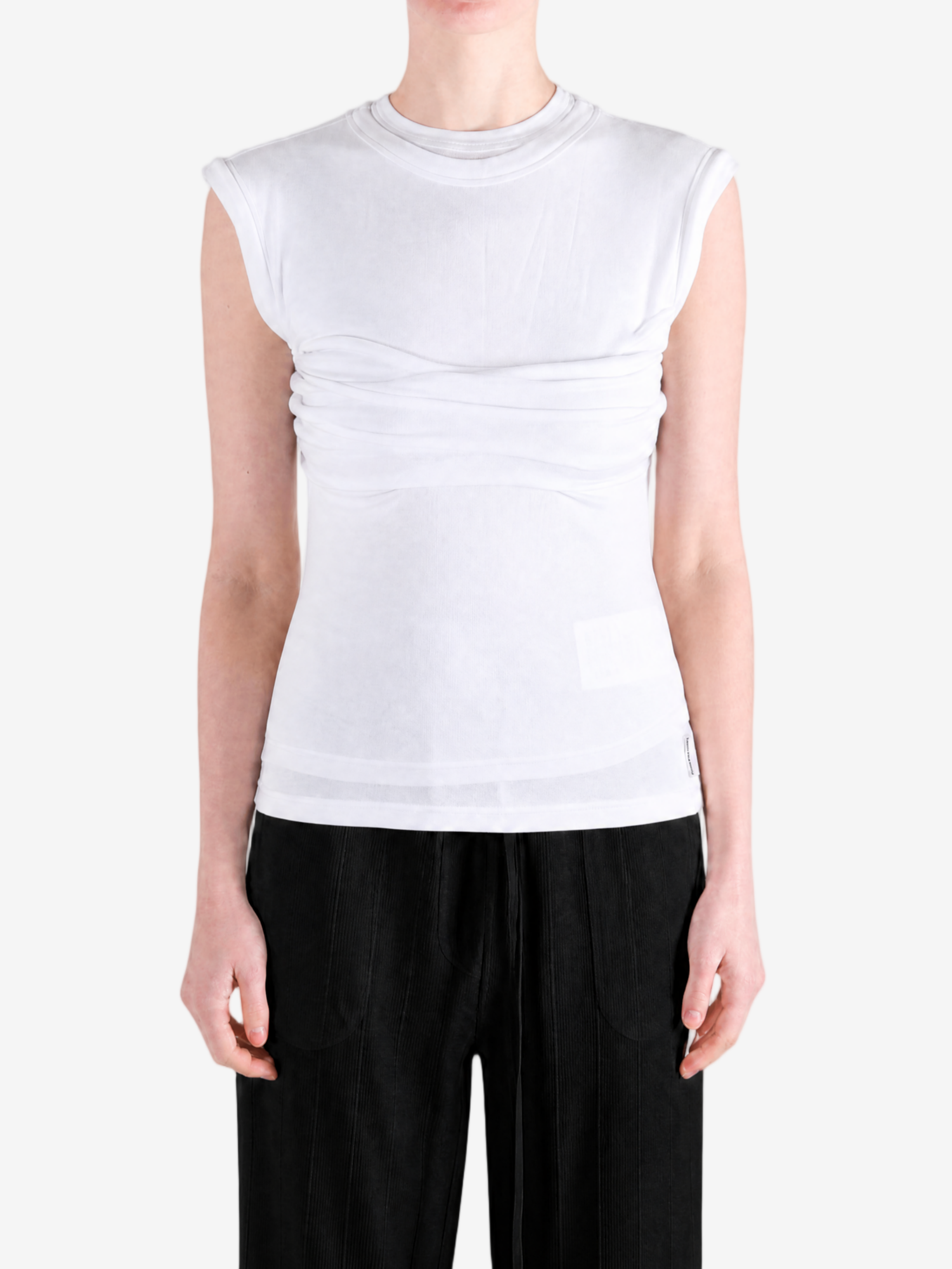 White top worn by a person, showing the top fit