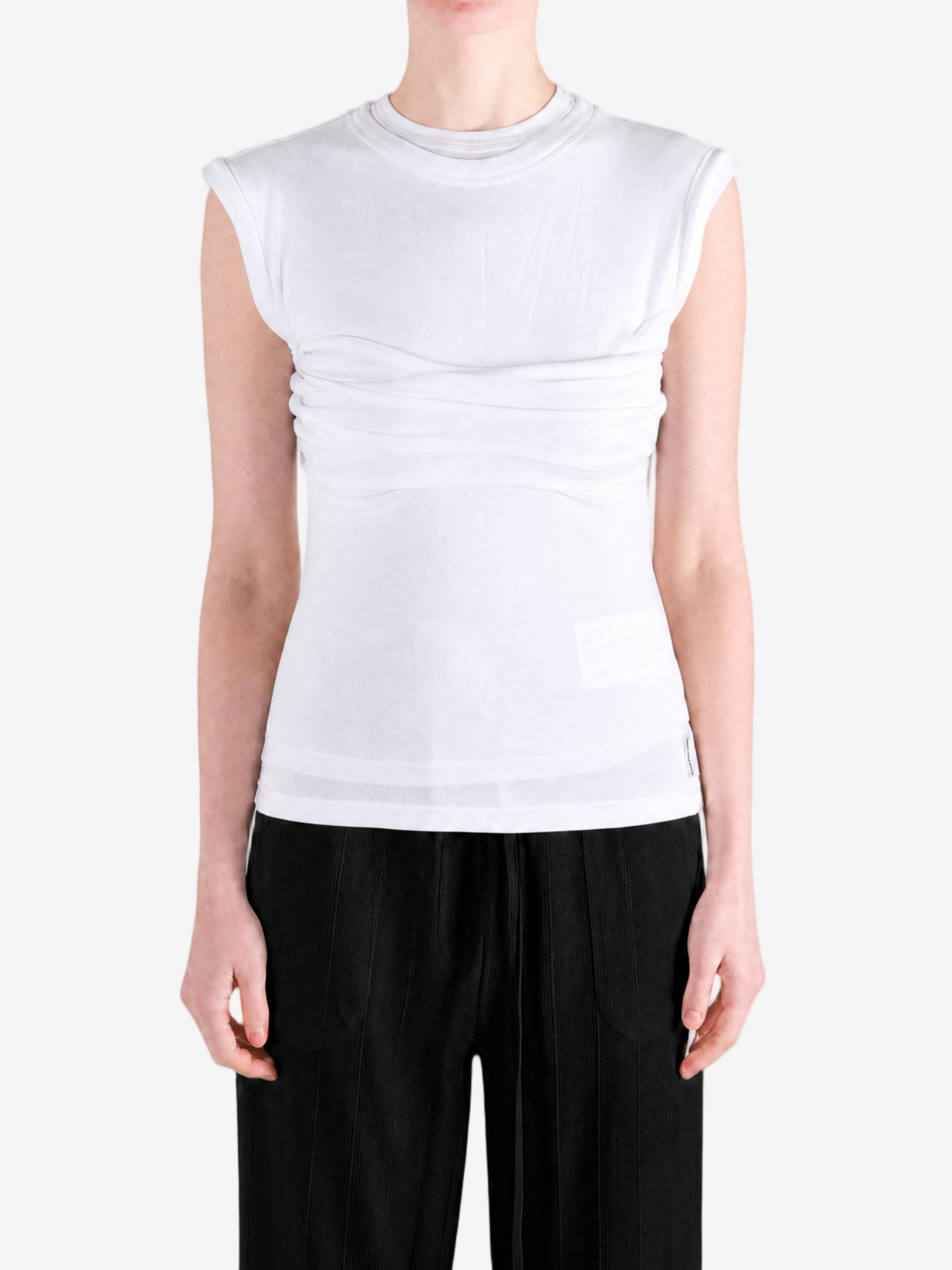White top worn by a person, showing the top fit