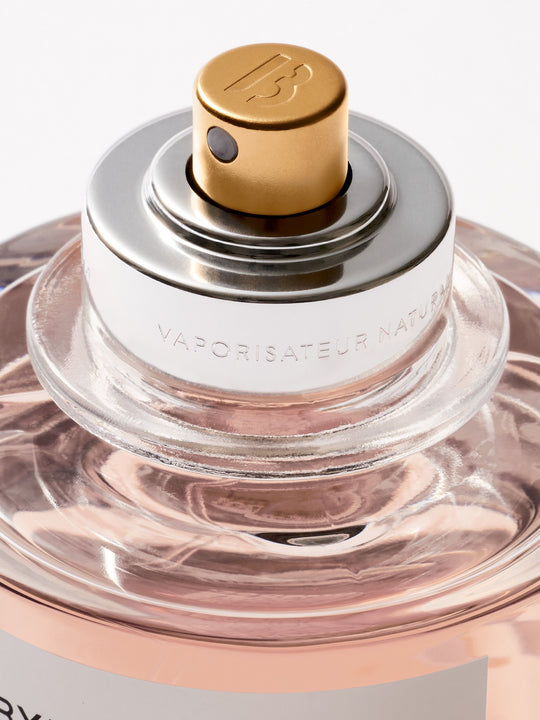 Close up of perfume, showing texture of the rose flower oil ingredients