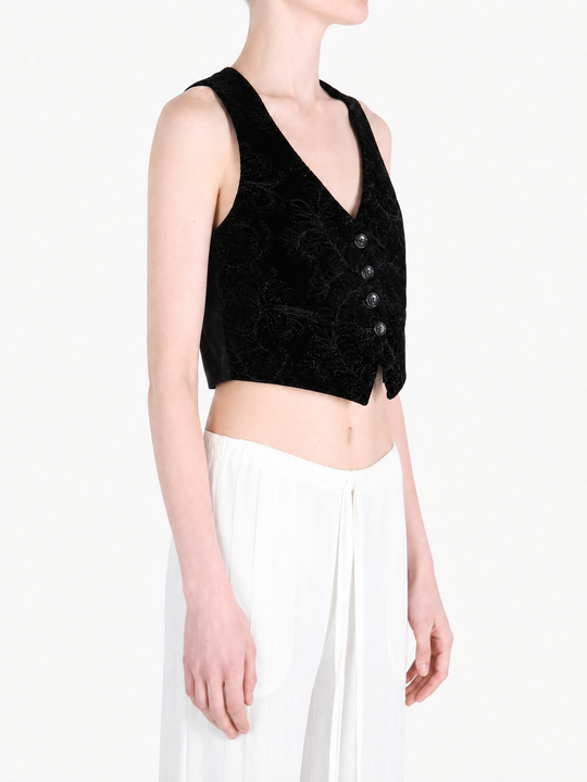 Black jacket worn by a person, showing the jacket fit