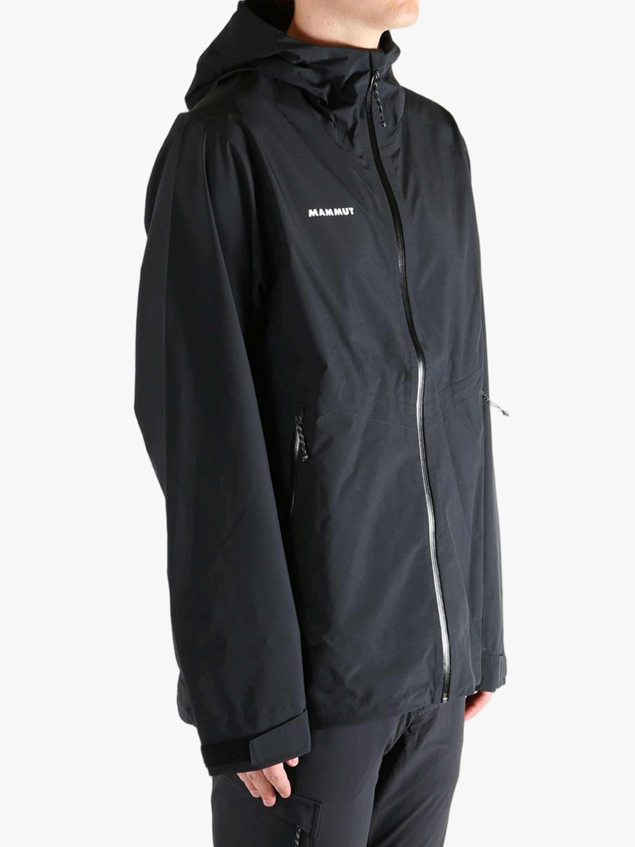 Black jacket worn by a person, showing the jacket fit