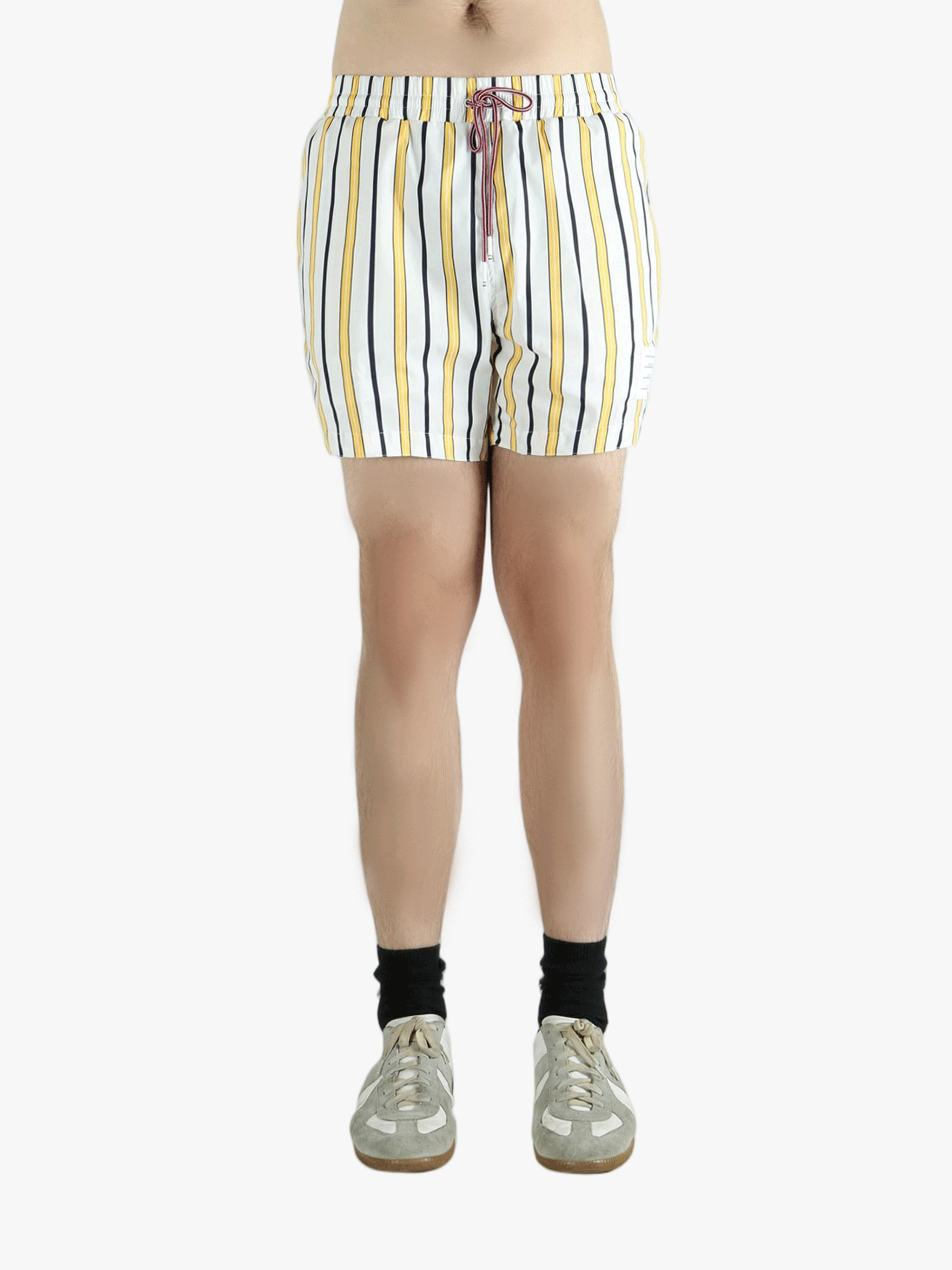 Yellow short worn by a person, showing the short fit