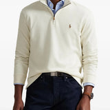 Tan knitwear worn by a person, showing the knitwear fit