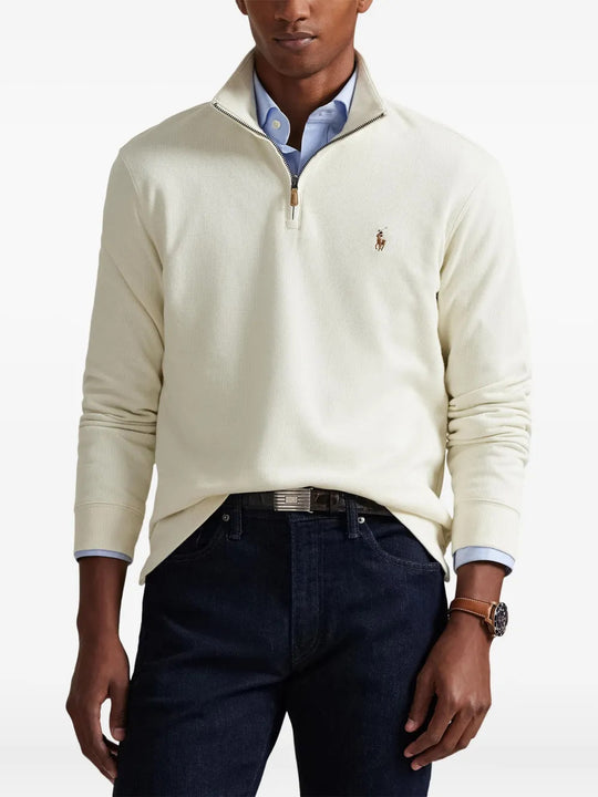 Tan knitwear worn by a person, showing the knitwear fit