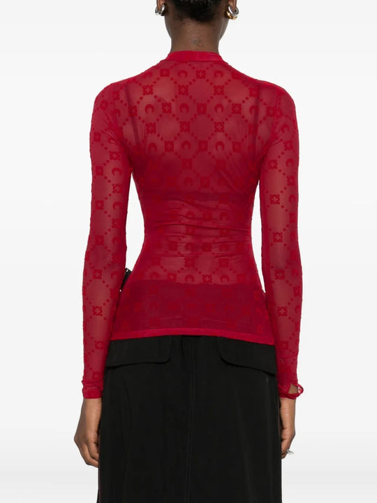 Red top worn by a person, showing the top's fit