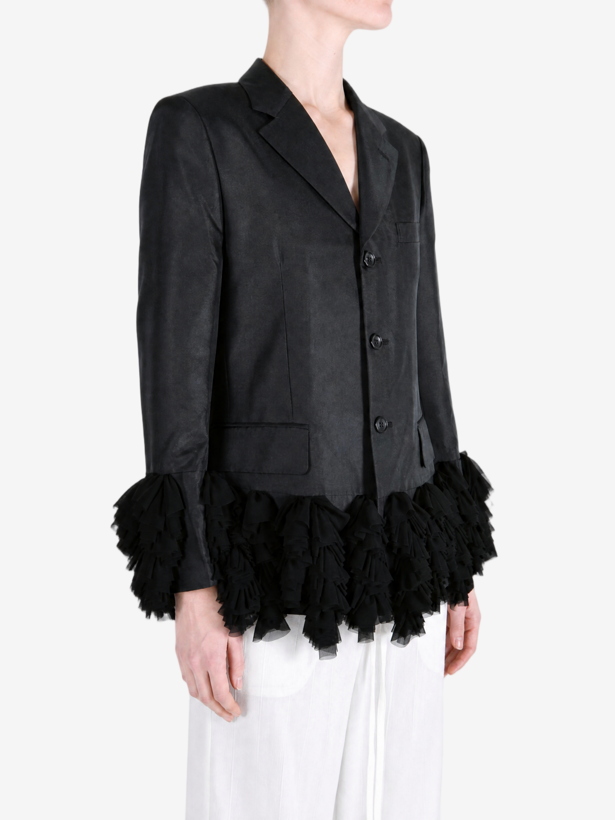Black jacket worn by a person, showing the jacket fit