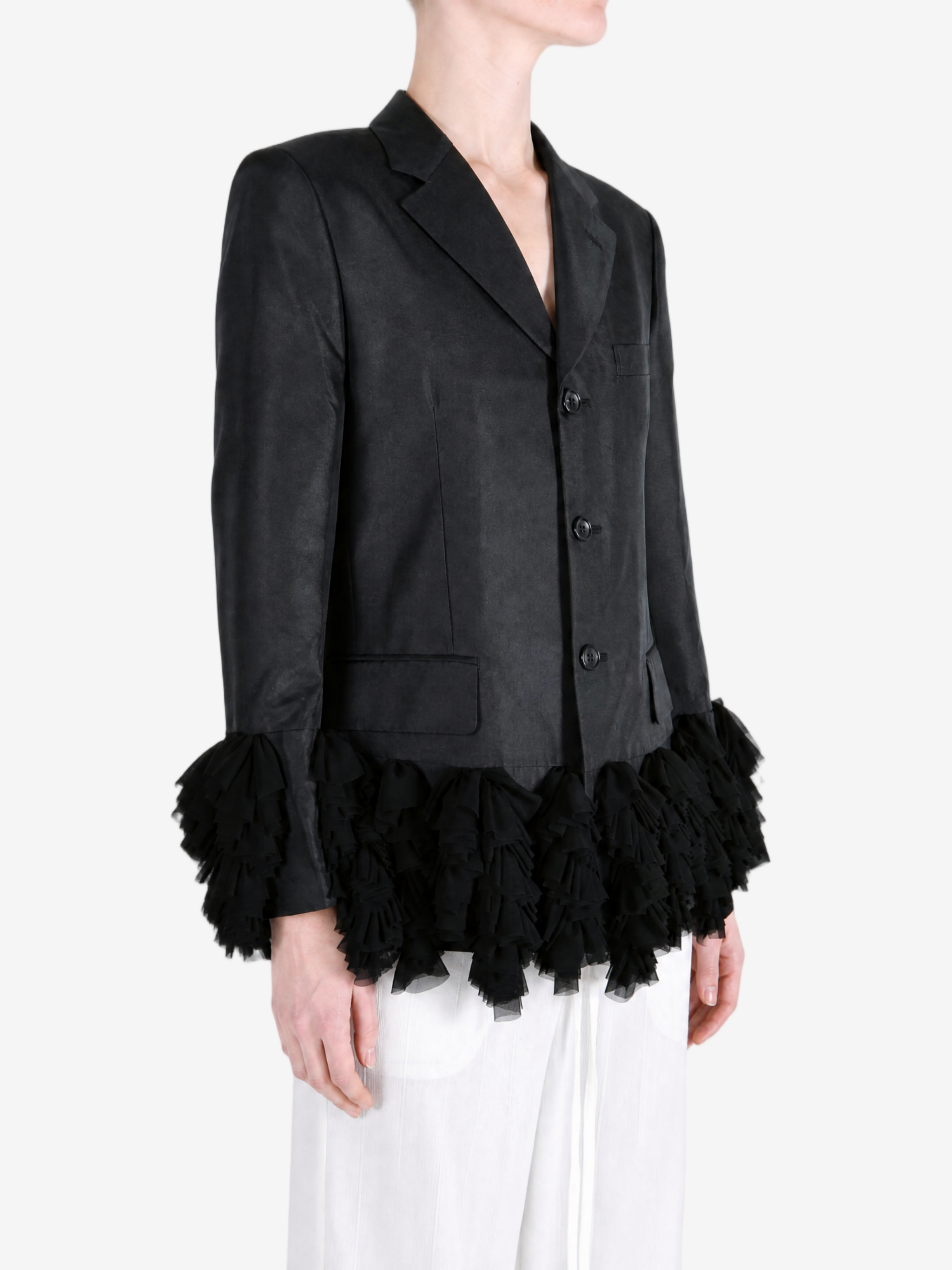 Black jacket worn by a person, showing the jacket fit
