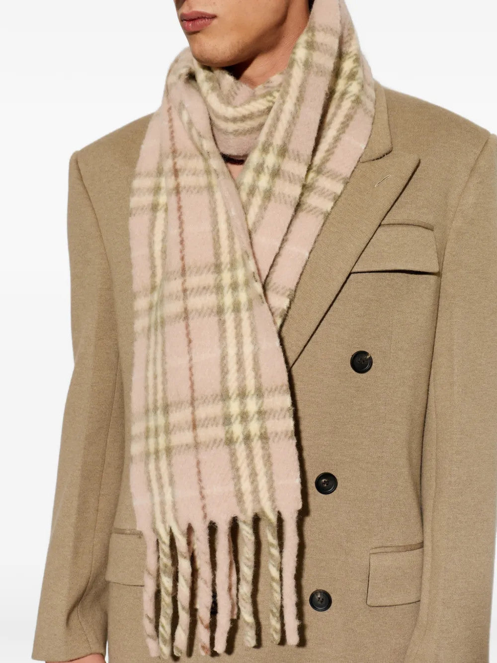 Pink scarf worn by a person, showing the scarf fit