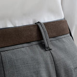 Grey pants worn by a person, showing the pants fit