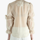 Tan t-shirt worn by a person, showing the t-shirt's fit