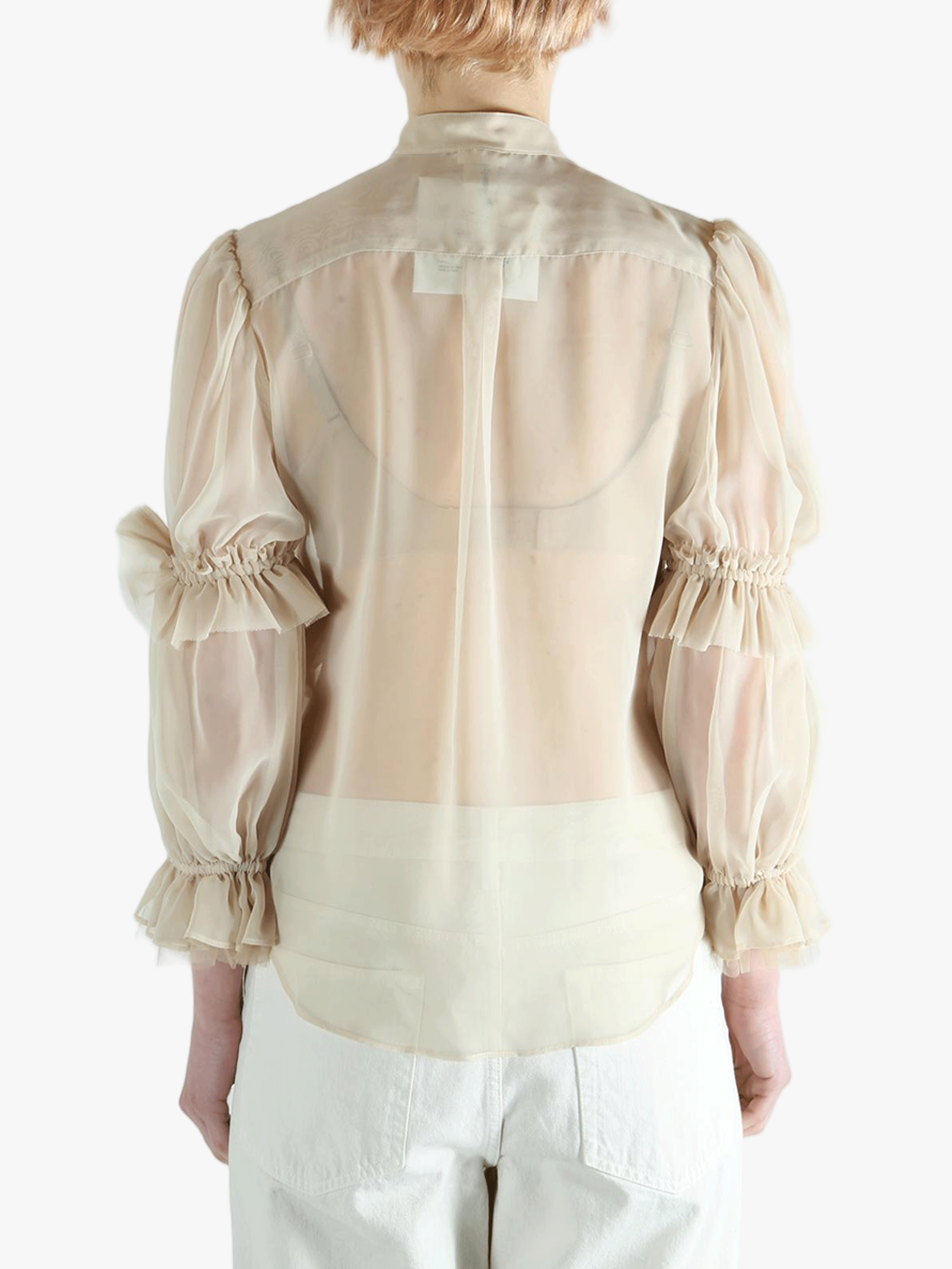Tan t-shirt worn by a person, showing the t-shirt's fit