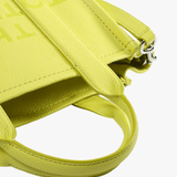 Close up of the green bag, showing texture of the leather fabric